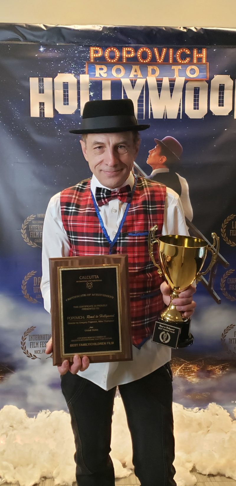Gregory Popovich with the Calcutta film festival trophy