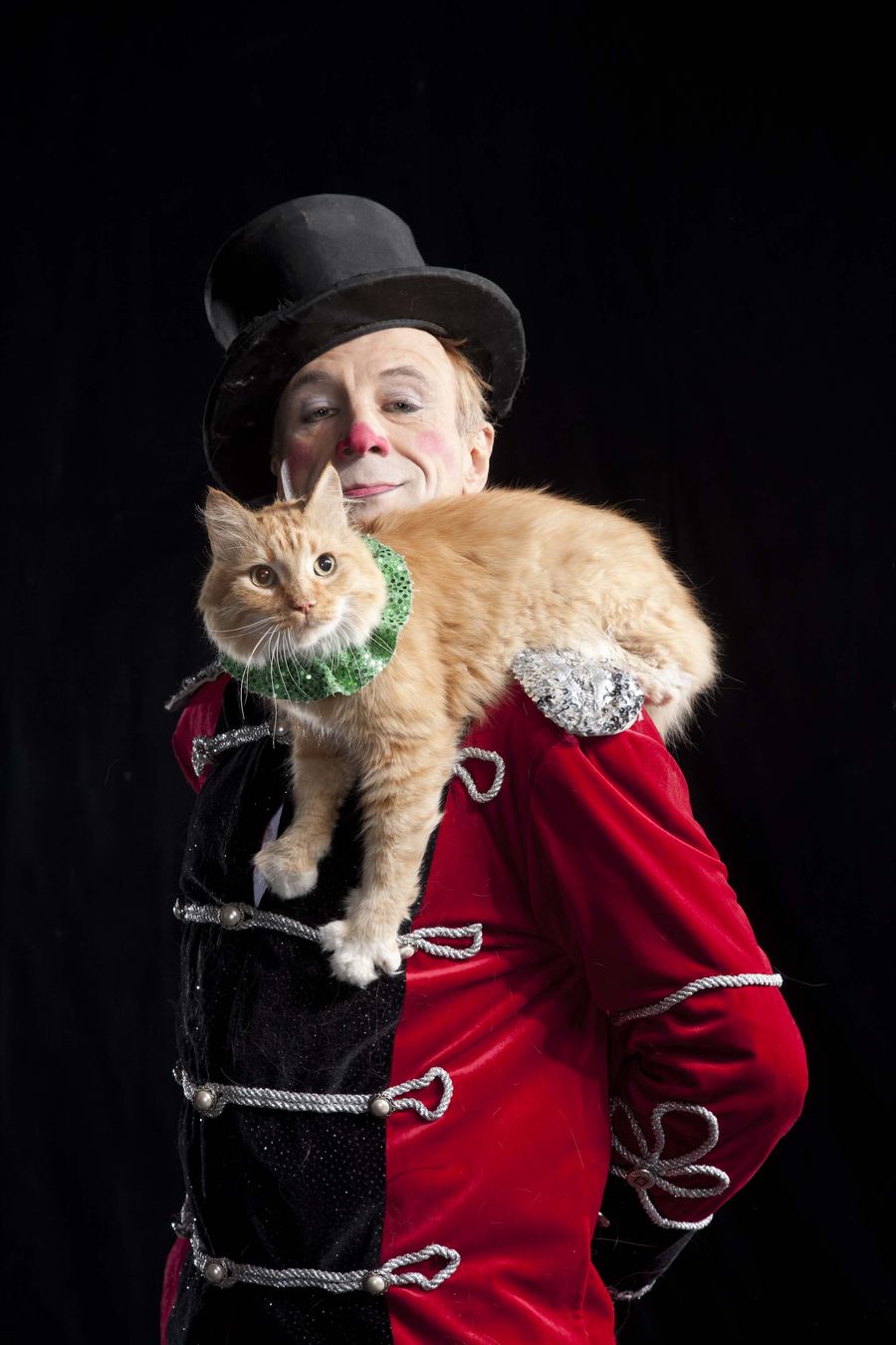 Gregory Popovich with his rescued orange cat